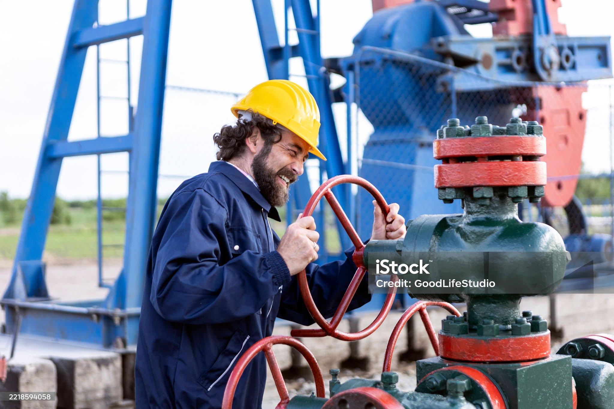 Oil industry worker working in an oil field.